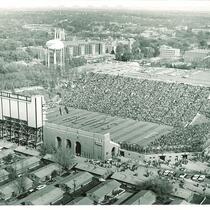 Aerial view of football stadium with arched Armory and Field House behind, The University of Iowa, October 24, 1953