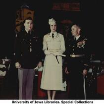 Honorary Cadet Colonel Majorie Campbell on stage at military ball, The University of Iowa, 1950