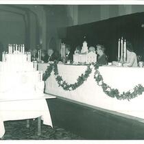 Cake with candles and the head table for the 100th anniversary of the Old Capitol party, The University of Iowa, 1947