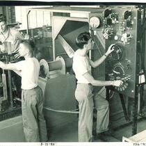 Adjusting levers and dials in Hydraulics Laboratory, The University of Iowa, August 15, 1948