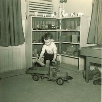 Boy playing with toy truck, The University of Iowa, February 22, 1938