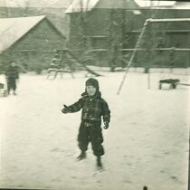 Small boy playing in the snow, The University of Iowa, January 1938
