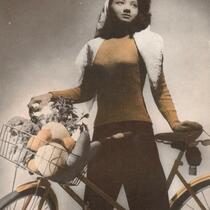 Arlene Roberts Morris posed with bicycle, Iowa City, Iowa?, 1946