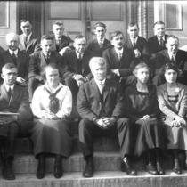 Group of Geology professors and assistants in front of Old Science Hall, The University of Iowa, 1900s