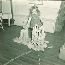 Girl playing with wooden blocks, The University of Iowa, January 1938