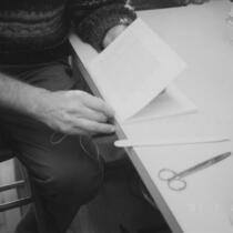 Larry Yerkes hand sewing bindings, circa 2002