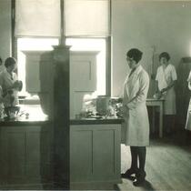 Baking in home economics laboratory, The University of Iowa, 1920s