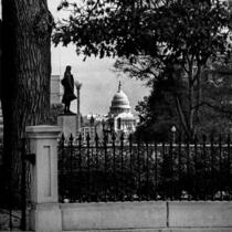 U.S. Capitol framed by a fence, a statue, and a tree, Washington, D.C., November 11, 1977