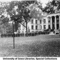 Cadets in line at the Hall of Natural Science for barracks assignment, The University of Iowa, 1918