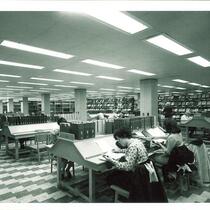 Students studying at tables in Main Library, The University of Iowa, 1970