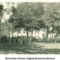 Academic procession heading south on Pentacrest, The University of Iowa, 1920s?