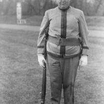 Cadet in uniform with rifle, The University of Iowa, 1914